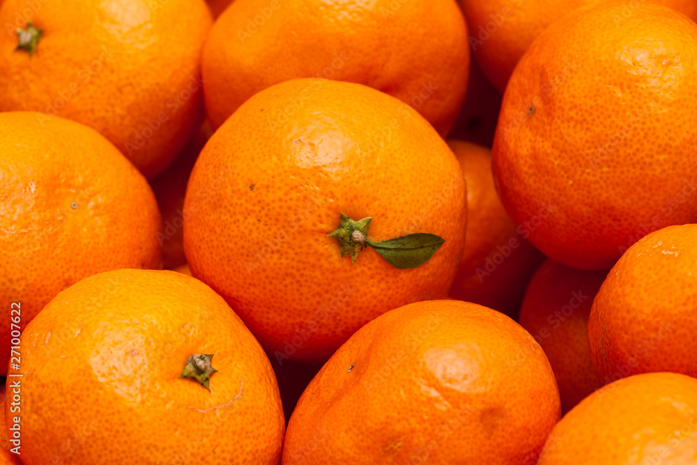 Close up of pile of fresh juicy mandarin oranges