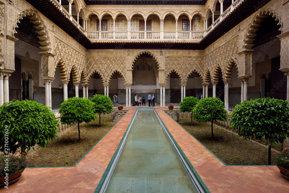 Reflecting pool in the Courtyard of the Maidens at Alcazar palace Seville Andalusia