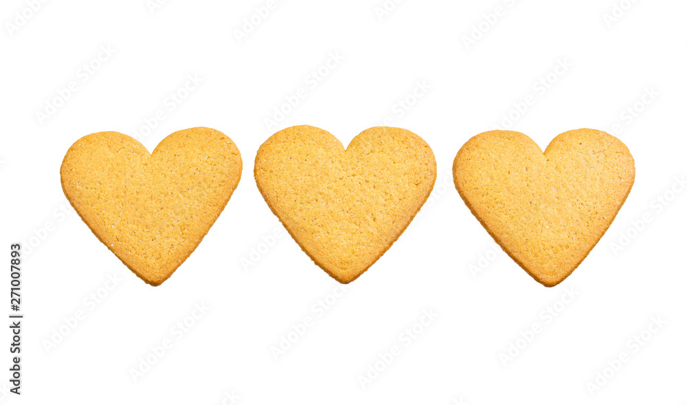 Three hearts of ginger dough cookies isolated on white background. Sweet dessert beautiful ornament pattern Three hearts of ginger dough cookies isolated on white background. Sweet dessert beautiful ornament pattern