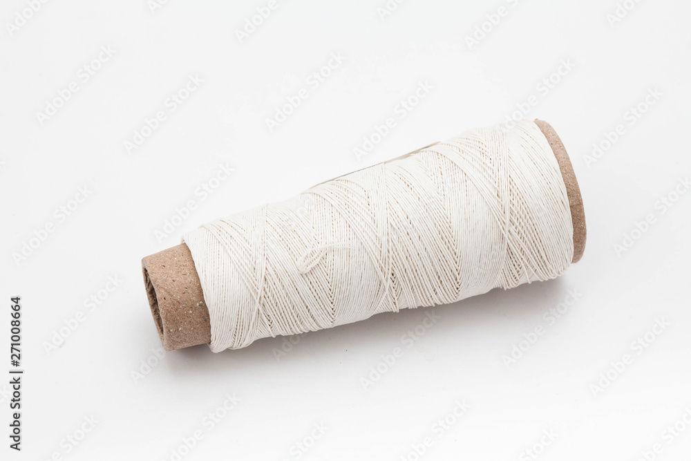 A spool of thread isolated on white background A spool of thread isolated on white background