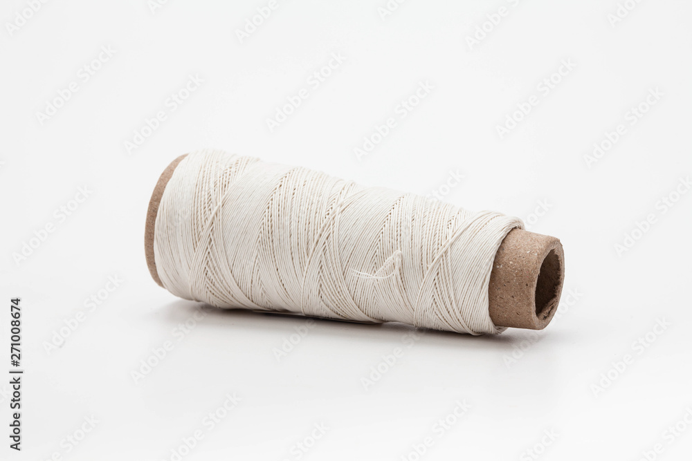 A spool of thread isolated on white background A spool of thread isolated on white background
