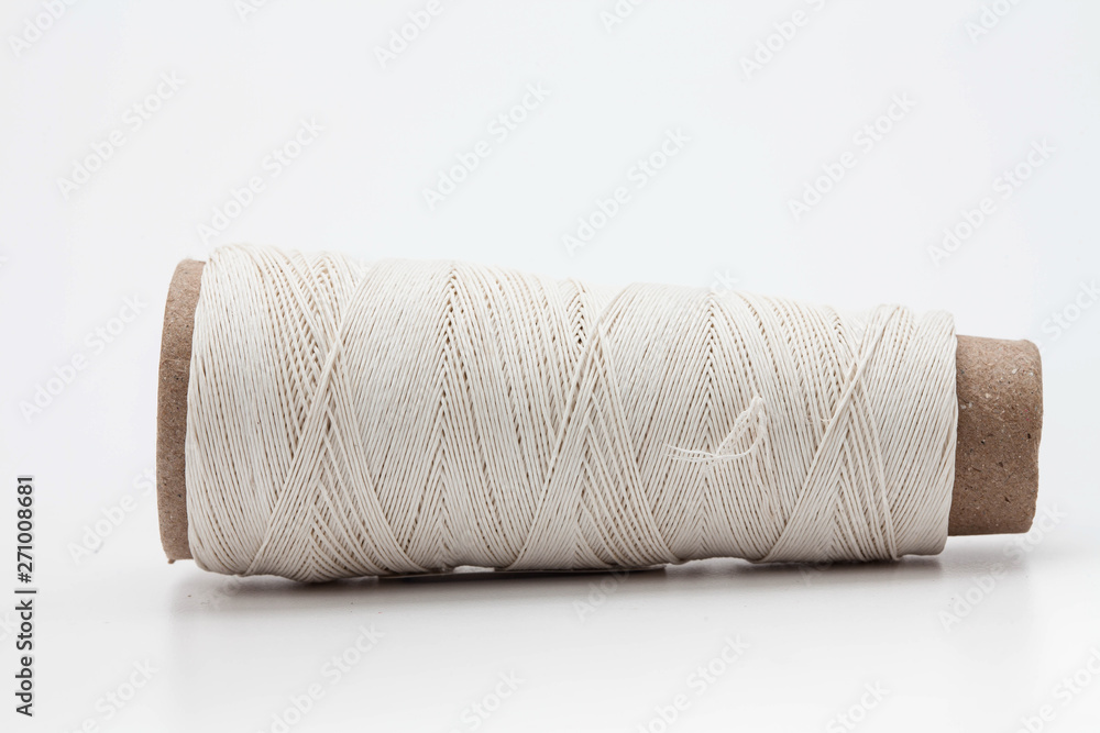 A spool of thread isolated on white background A spool of thread isolated on white background