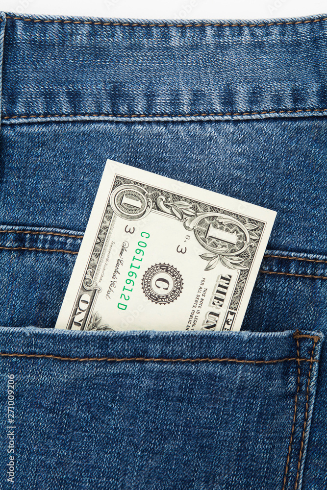 One dollar bill in the back pocket of blue jeans One dollar bill in the back pocket of blue jeans