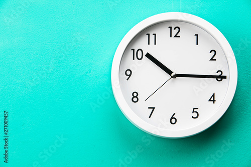 Wall clock at abstract background surface