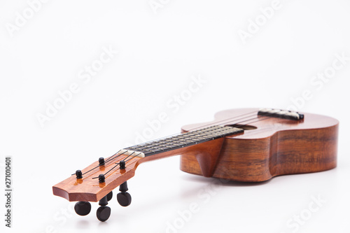  The ukulele guitar isolated on white