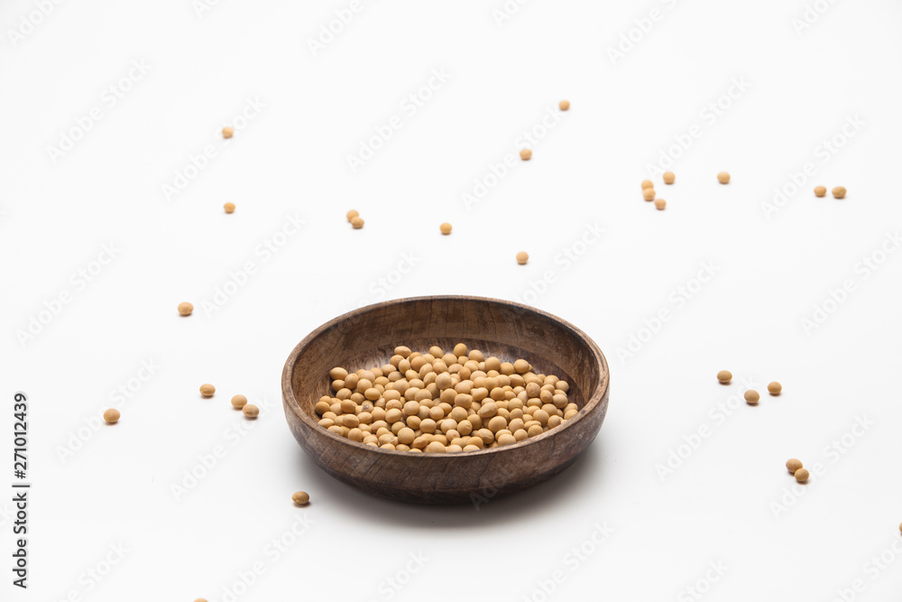 Dried soy beans in wooden bowl isolated Dried soy beans in wooden bowl isolated