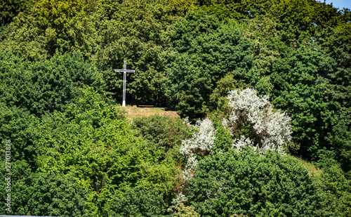 White cross on nature background