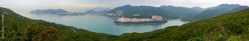 Fototapeta premium Super wide panorama of Tai Tam Bay and Red Hill in Hong Kong, as seen from Dragon's Back hiking trail
