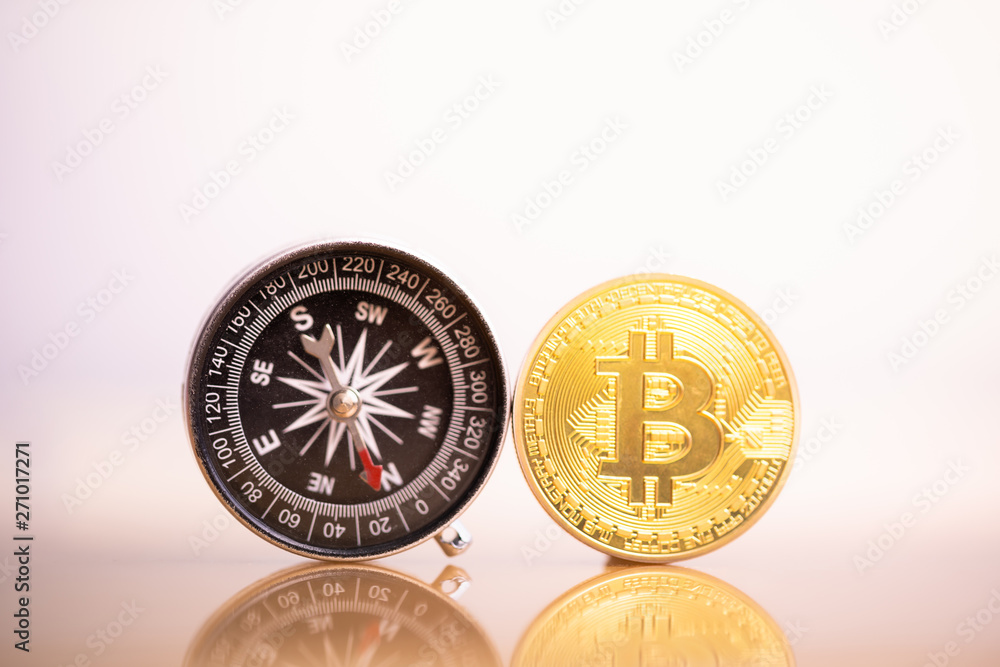 Bitcoin coin and compass. Bitcoin and altcoin with compass..Future direction or forecast of cryptocurrency price concept.