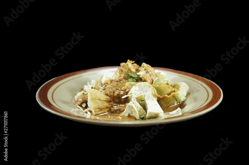 Gado-Gado Indonesian food. A mixture of tofu, rice cake, salad and spicy peanut sauce. photo