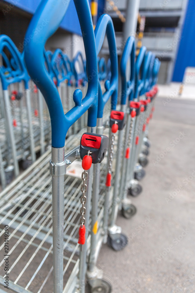  Neatly arranged coin-operated shopping carts, shopping malls