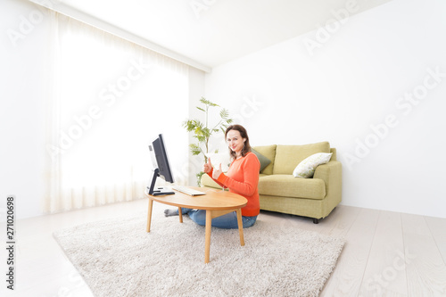 Online lesson teacher in front of computer