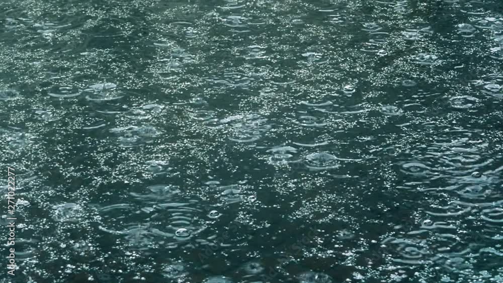 Rain falling on pavement. Rain falling on pavement.