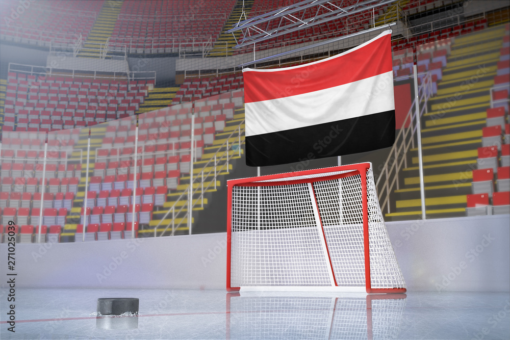 Obraz premium Flag of Yemen in hockey arena with puck and net