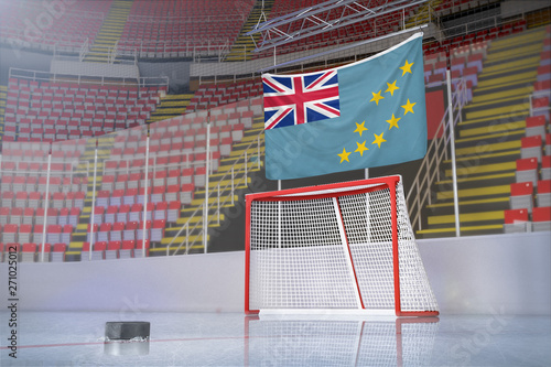 Flag of Tuvalu in hockey arena with puck and net