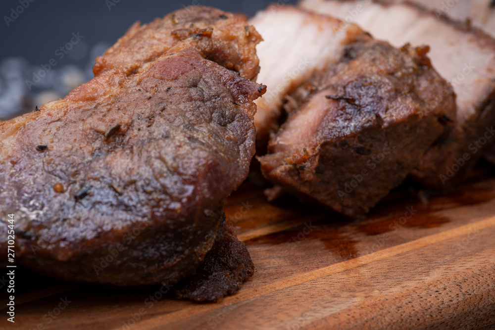 Oven Roasted Pork with spices on wooden cutting board. Oven Roasted Pork with spices on wooden cutting board.