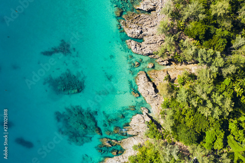 Fototapeta Naklejka Na Ścianę i Meble -  View from above, stunning aerial view of a tropical coast bathed by a turquoise clear sea. Phuket, Thailand.