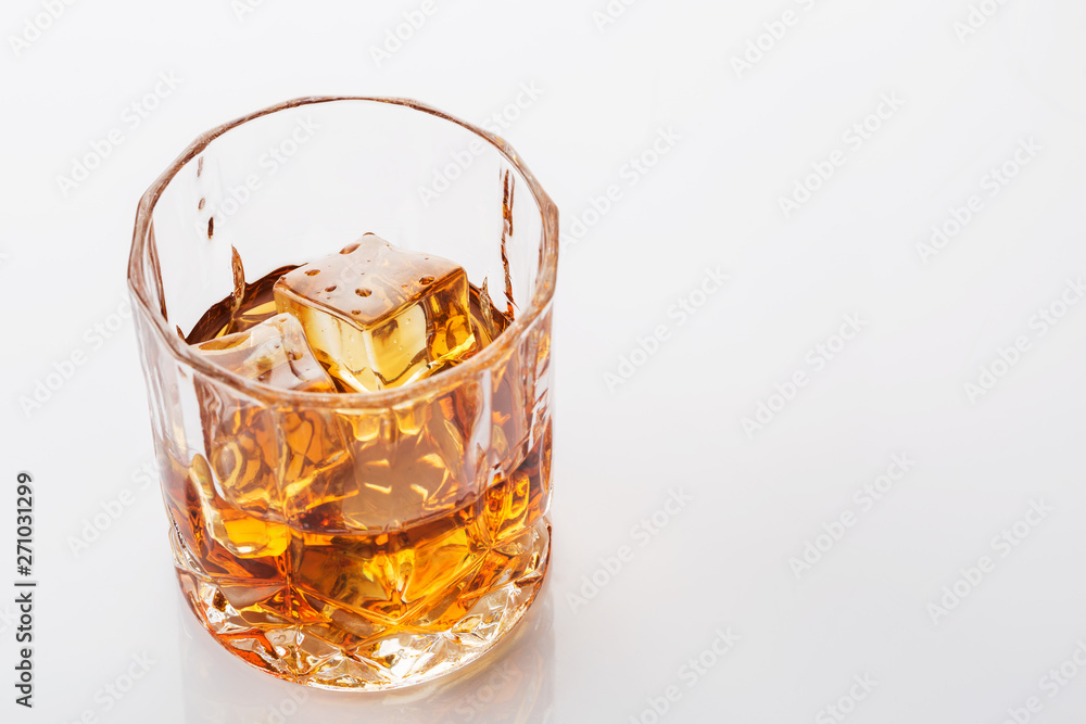 Glass of scotch whiskey on white background Glass of scotch whiskey on white background