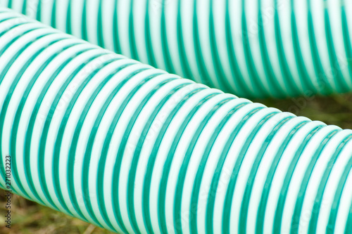 Plastic corrugated pipes in agricultural or industrial machinery, technology concept photo