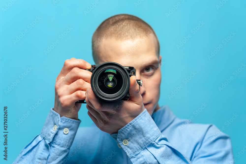 Young male guy photographer with dslr camera Young male guy photographer with dslr camera