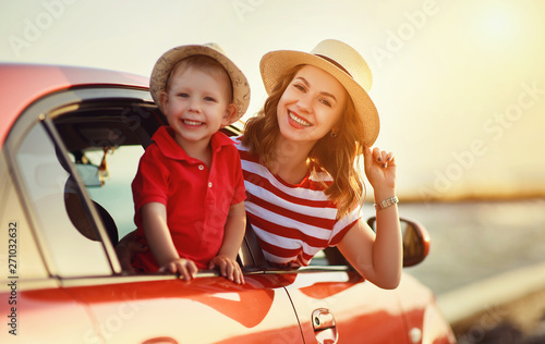 happy family mother and child boy goes to summer travel trip in car. photo