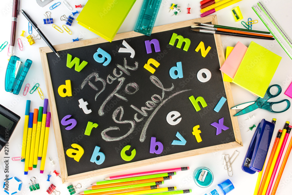 Blackboard with colorful alphabets kids back to school concept, all school and office stationery supplies Blackboard with colorful alphabets kids back to school concept, all school and office stationery supplies