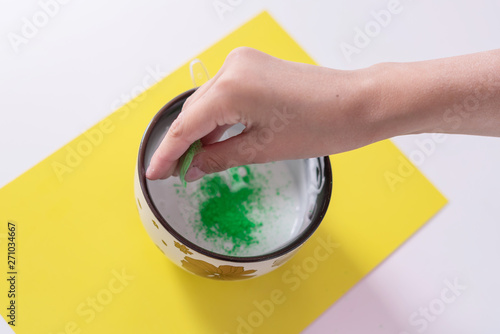 a girl making slime herself