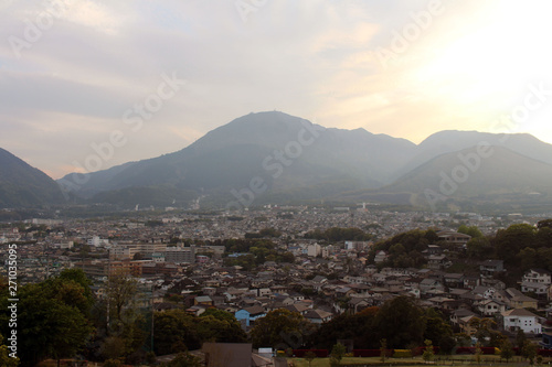 The landscape of Beppu in Oita and golf range as seen from a hill in sunset photo