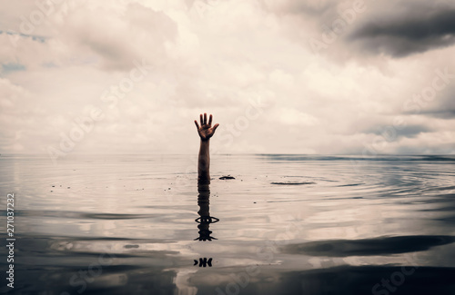 Картината върху платно Hand of man want to helping after drown in the lake
