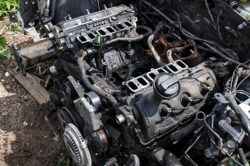 old and dirty disassembled V6 diesel engine in the car