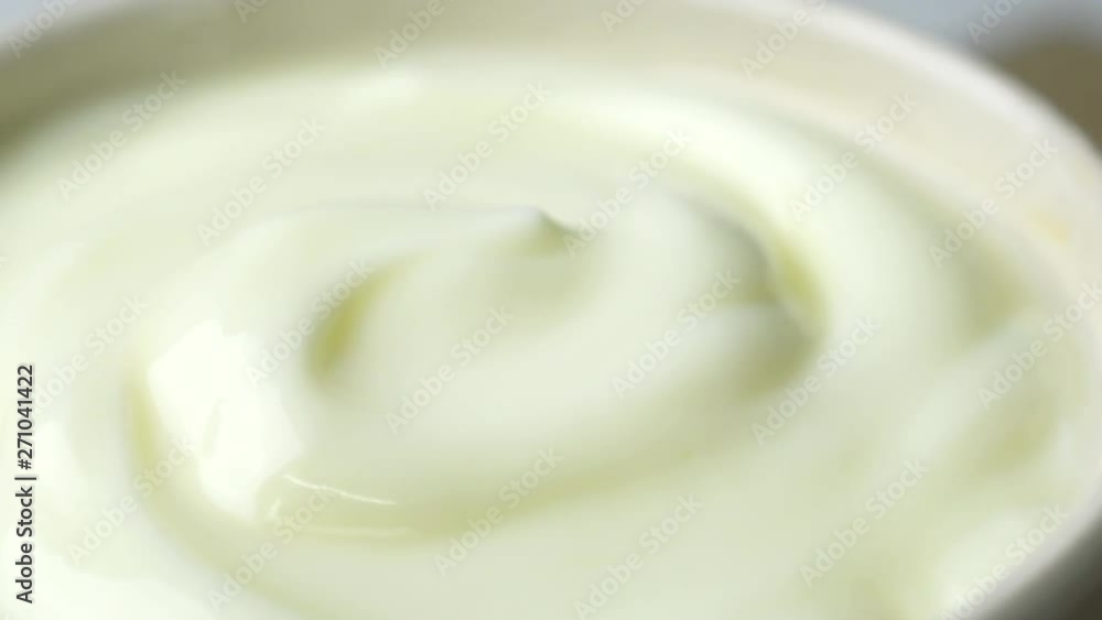 Rotating of closeup shot yogurt in 4K resolution Rotating of closeup shot yogurt in 4K resolution
