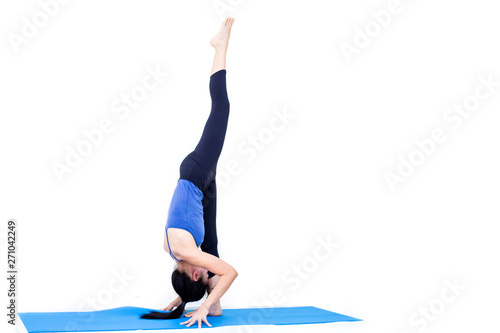 Beautiful Asia girl practicing yoga on isolated white background : Concept practicing