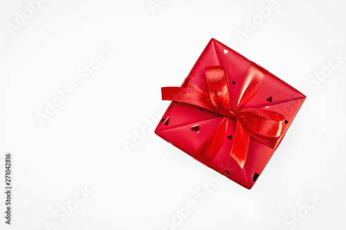 One red box with surprise for any occasion.Gift in box. Birthday.  Concept of gifts. Close-up.