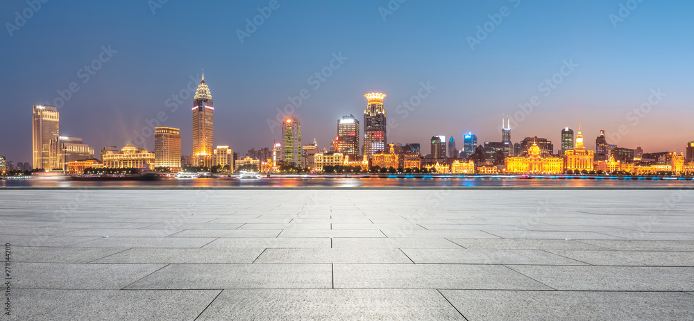 Shanghai bund city skyline and empty square floor at night,panoramic view