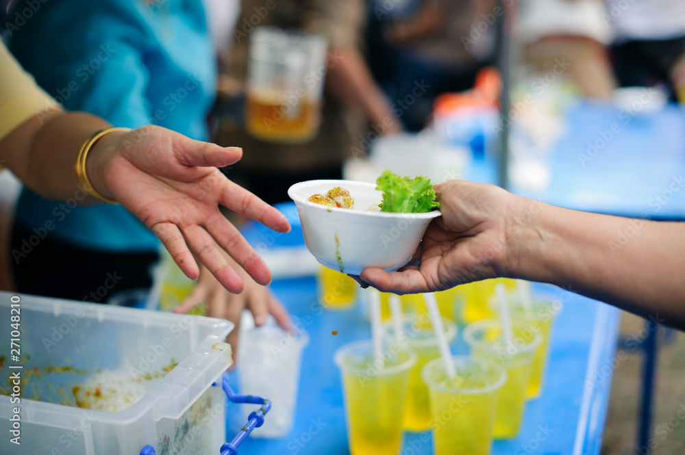 The concept of feeding : The hands of the poor receive food from the hands of the humane : Helping Feed the Poor