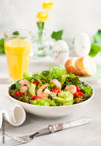 Fresh summer salad with shrimp, avocado and tomato