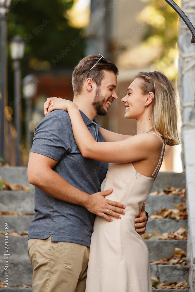 Young and beautiful couple embracing and smiling after kiss Young and beautiful couple embracing and smiling after kiss