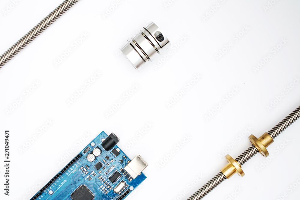 Mega board with running gear elements - running shaft, nuts and vibration damping clutch. Set for DIY robotics in fab lab. Flat lay isolated on white. Free space for text. Mega board with running gear elements - running shaft, nuts and vibration damping clutch. Set for DIY robotics in fab lab. Flat lay isolated on white. Free space for text.