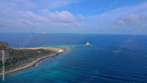 Aerial drone bird's eye view photo of tropical caribbean paradise bay and lagoon with white sandy beach and turquoise clear sea © aerial-drone