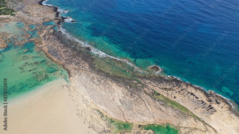 Aerial drone bird's eye view photo of tropical caribbean paradise bay and lagoon with white sandy beach and turquoise clear sea Aerial drone bird's eye view photo of tropical caribbean paradise bay and lagoon with white sandy beach and turquoise clear sea