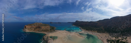 Aerial drone panoramic view of iconic azure turquoise Balos beach lagoon near Gramvousa island and pure white sand, North West Crete island, Greece