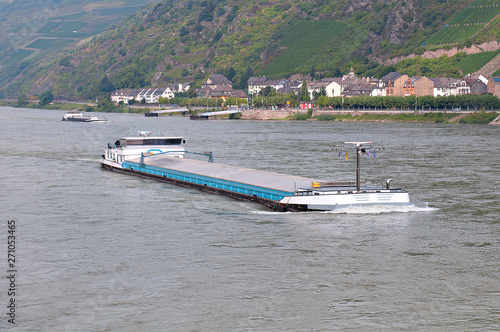 Barge with cargo on the river. Fototapeta