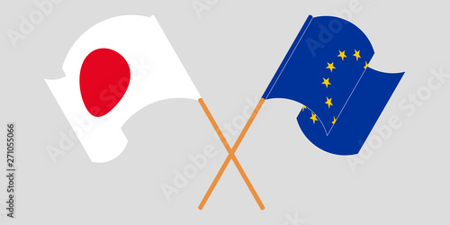 Crossed and waving flags of the EU and Japan