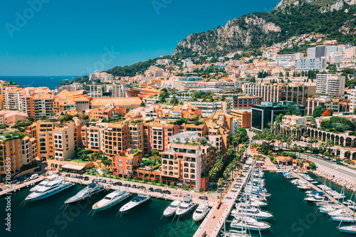 Monaco, Monte Carlo. Yachts Moored Near City Pier, Jetty In Sunny Summer Day. Monaco, Monte Carlo Cityscape Skyline