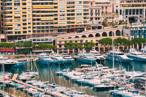Monaco, Monte Carlo. Yachts Moored Near City Pier, Jetty In Sunny Summer Day © Grigory Bruev