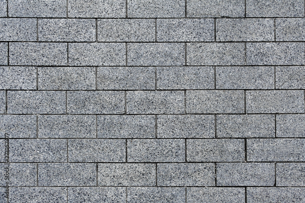 Top view on a gray pavement of granite tiles (texture, background) Top view on a gray pavement of granite tiles (texture, background)
