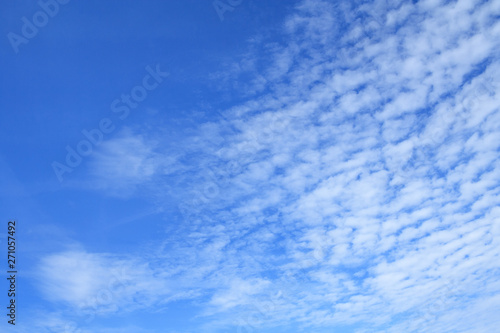 White clouds in azure sky as background