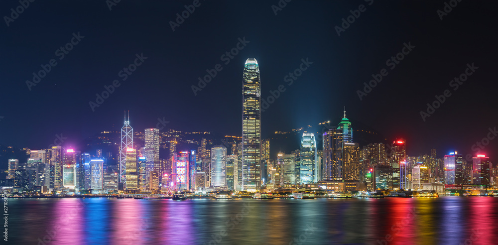 Naklejka premium Panorama of Victoria harbor of Hong Kong city at night