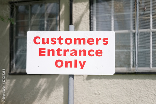 Customers entrance only sign at shop factory work place