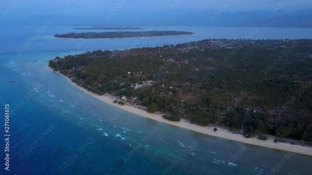 Aerial Backward: Small Islands in the Ocean at Dusk - Gili Islands, Bali Aerial Backward: Small Islands in the Ocean at Dusk - Gili Islands, Bali